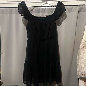 Black off the shoulder ruffled mini dress